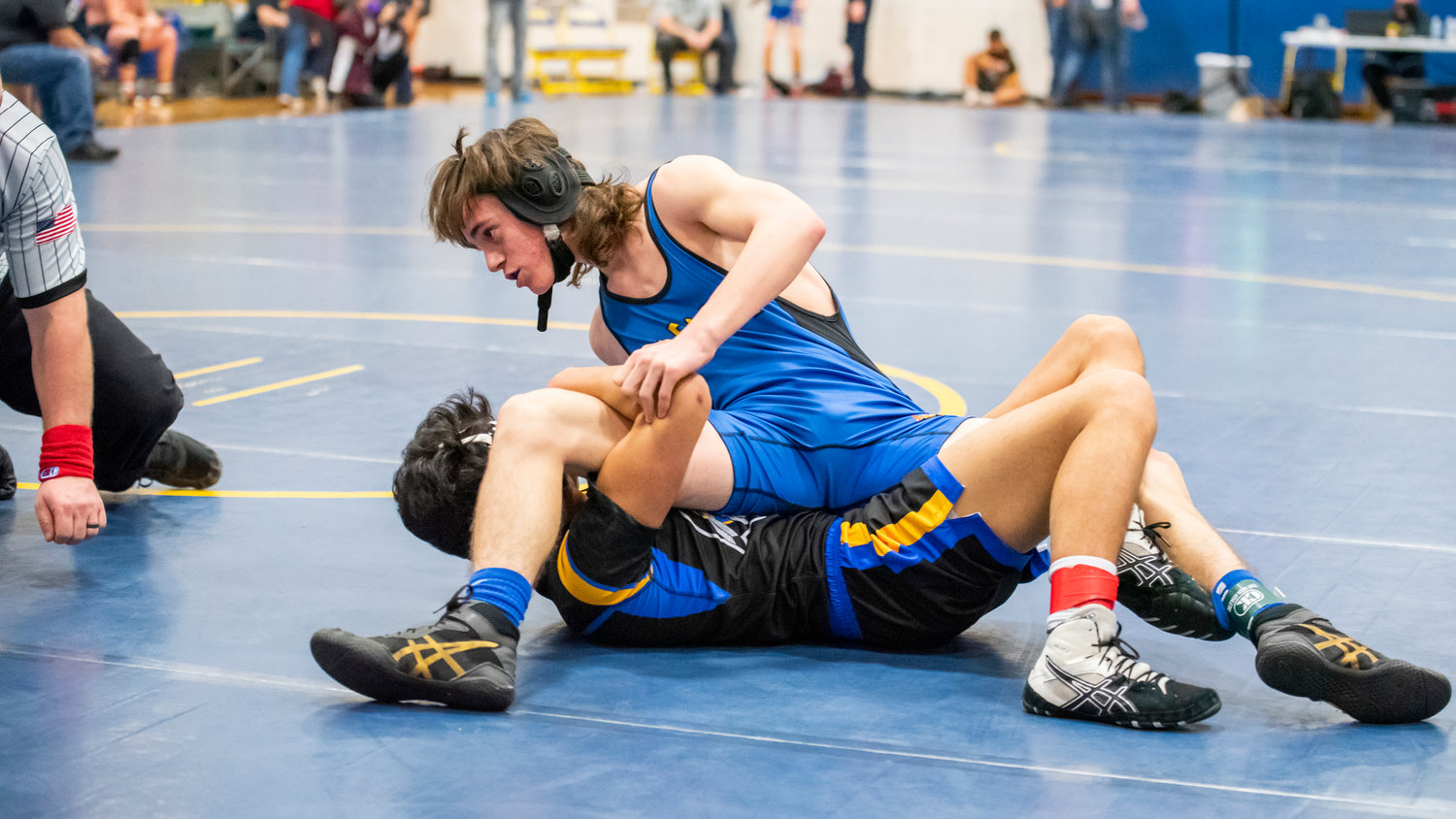 Adna’s Kooper Moon looks to pin his opponent during a wrestling match Saturday afternoon.